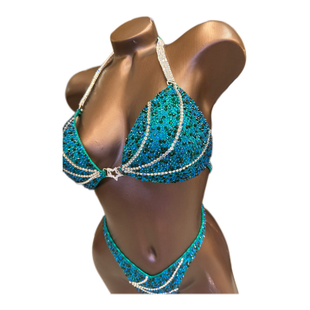 Emerald Wave Figure Competition Suit — Saleyla. Custom-made competition bikini for NPC, IFBB, WBFF. Stage-winning design.